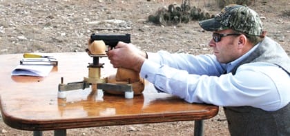 shooting a glock from a benchrest at the range in 2017