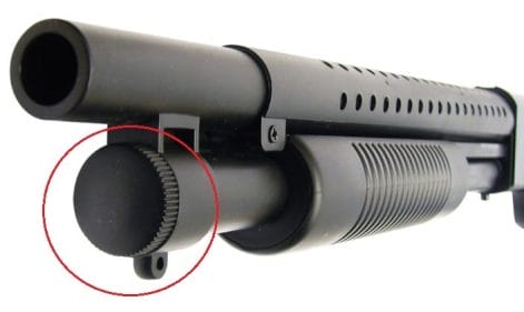 a picture of a shotgun with takedown screw encircled