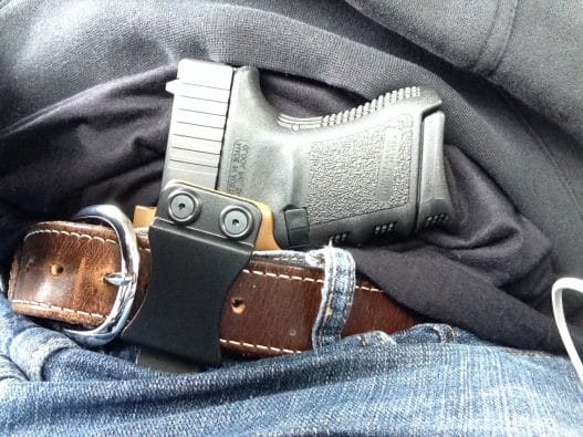 a picture of a glock tucked in an IWB holster