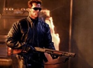 a picture of arnold schwarzenegger holding a remington 870