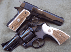 a picture of a 1911 and a S&W revolver