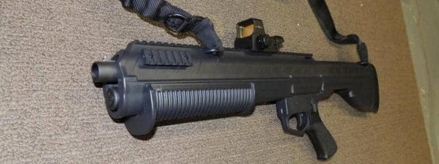 a picture of the Sightmark Ultra Shot mounted on a bullpup shotgun