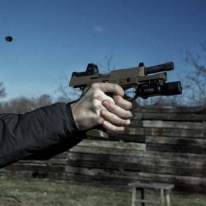 A picture of someone shooting an FNX 45 Tactical