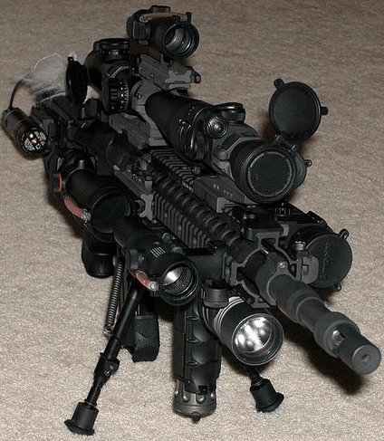 image of a gun with tons of scopes on top of it
