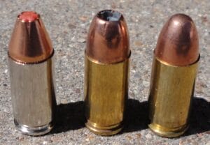 a picture of three 9mm cartridges with different bullet types