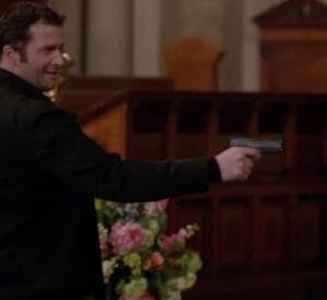 a picture of james purefoy holding a bersa bp9cc