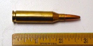 243 Winchester Cartridge being measured 