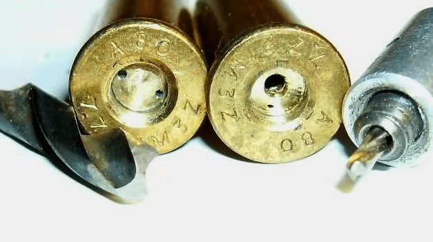 Closeup of a Berdan primed and a Boxer primed cartridge