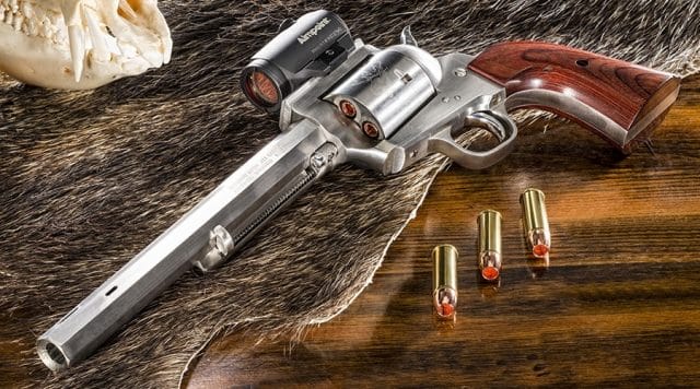 A picture of a Freedom Arms Model 83 revolver with 454 Casull cartridges
