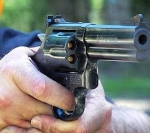 a picture of someone shooting a 357 magnum revolver