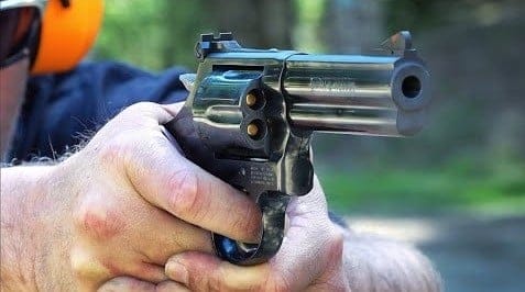 a picture of someone shooting a 357 magnum revolver