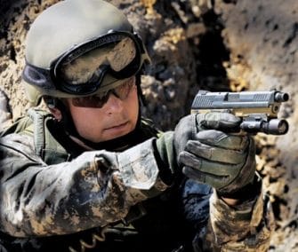 a picture of a US SOCOM Operative holding a handgun