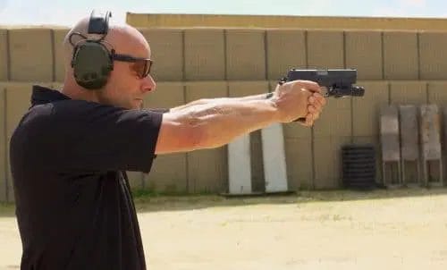 Working the trigger using a Glock pistol during a shooting drill